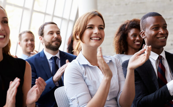 Audience Applauding Speaker At Business Conference