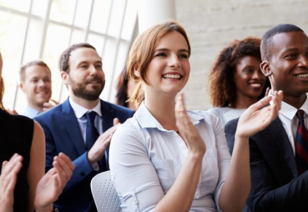 Audience Applauding Speaker At Business Conference