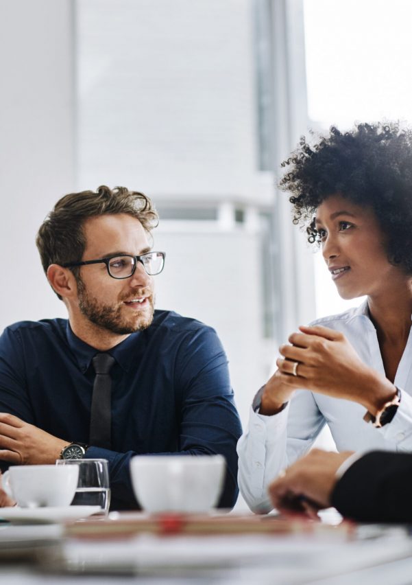 Shot of a group of businesspeople sitting together in a meeting